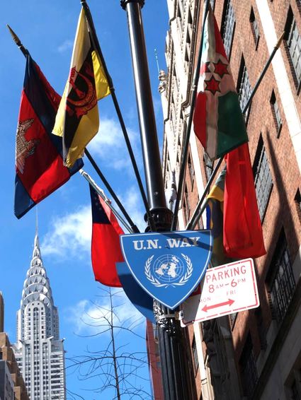 road sign „UN Way” with 6 international flags