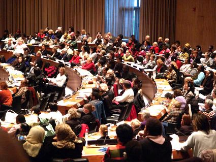 A lot of women sitting in a plenary meeting